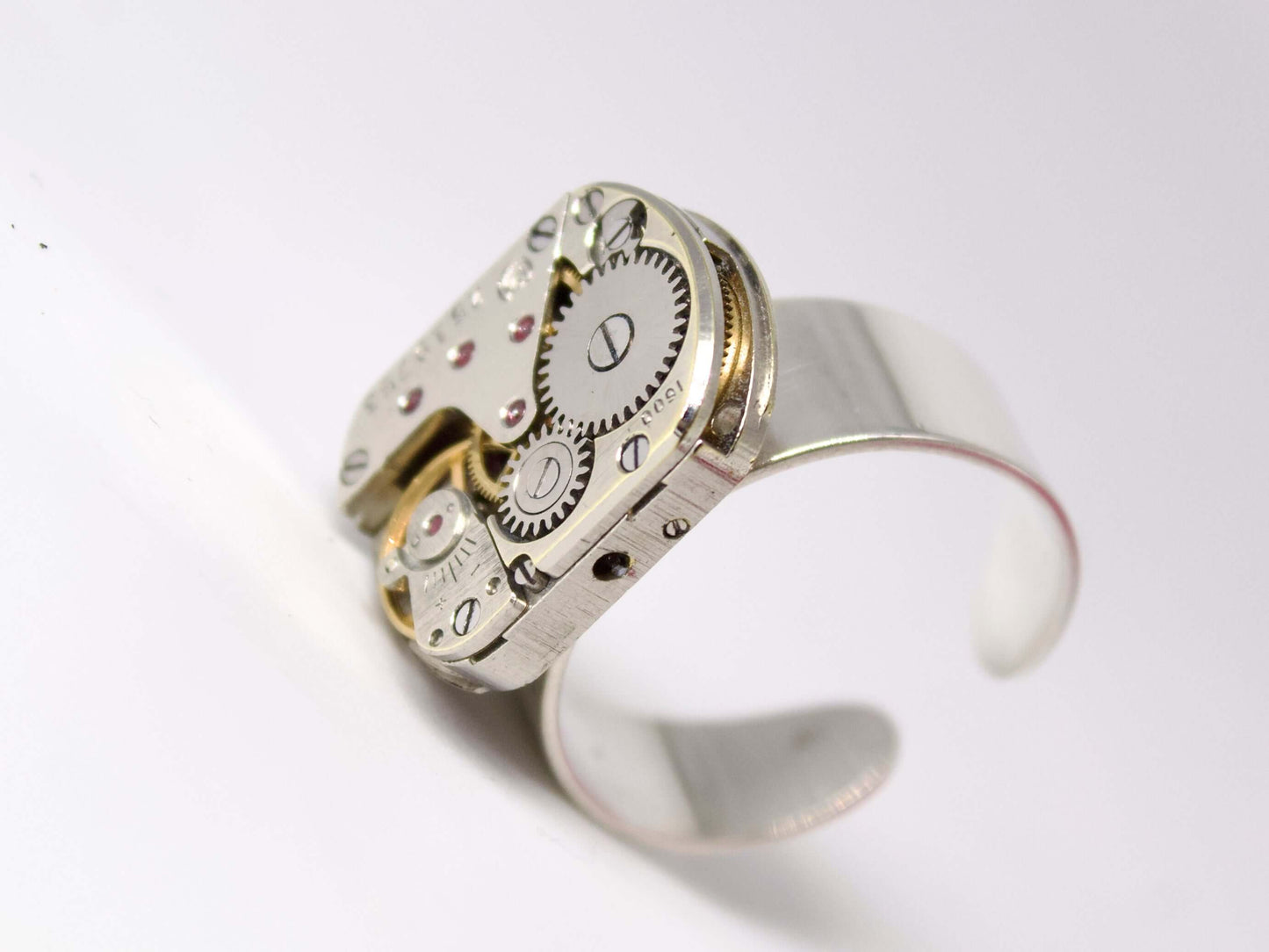 Anello con meccanismo di orologio di Glimoire in metallo argentato con ingranaggi visibili