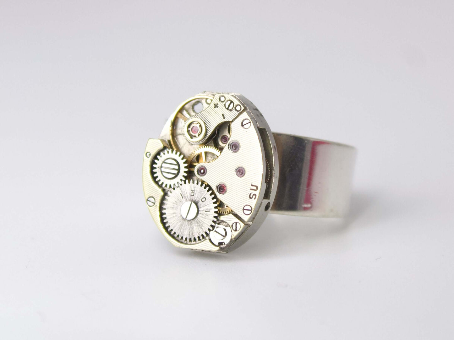 Anello con meccanismo di orologio Glimoire in metallo argentato con dettagli ingranaggi visibili