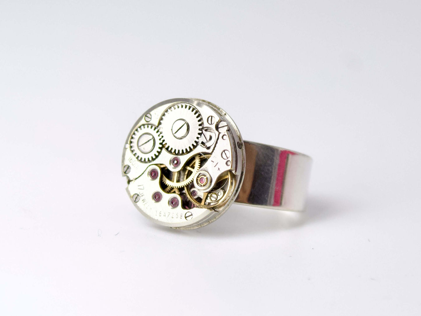 Anello con meccanismo di orologio Glimoire in metallo argentato con ingranaggi visibili