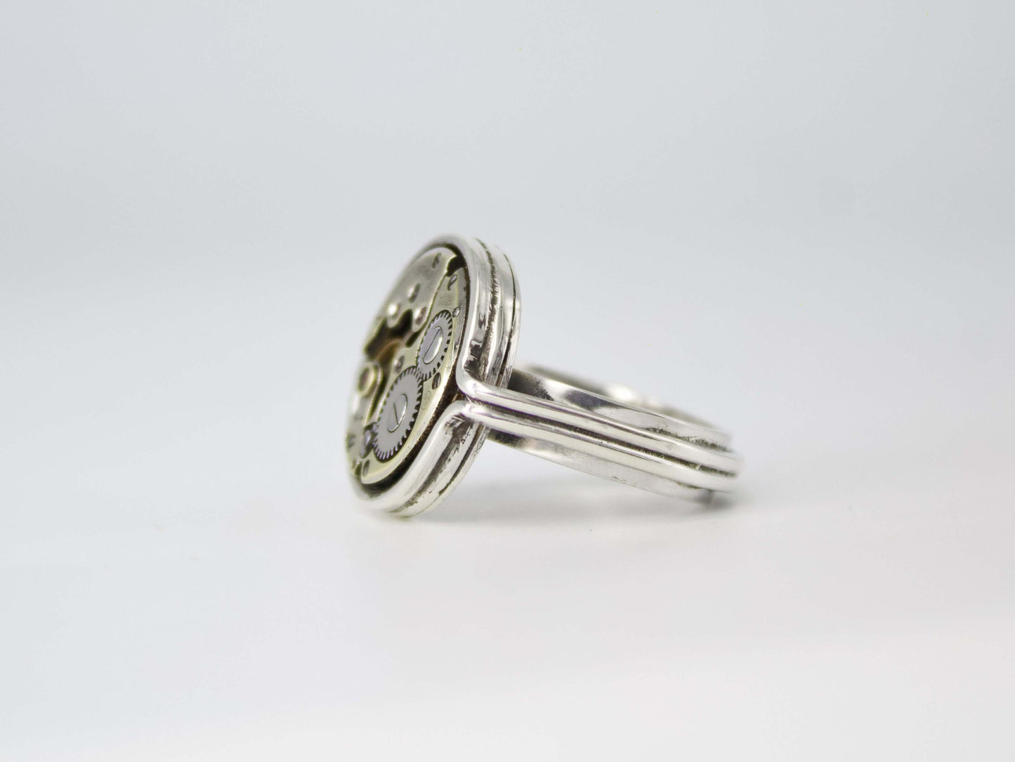 Anello con meccanismo di orologio in argento con dettagli ingranaggi vintage firmato Glimoire