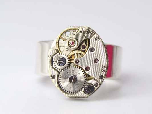 Anello con meccanismo di orologio Glimoire in argento con dettagli ingranaggi e rubini