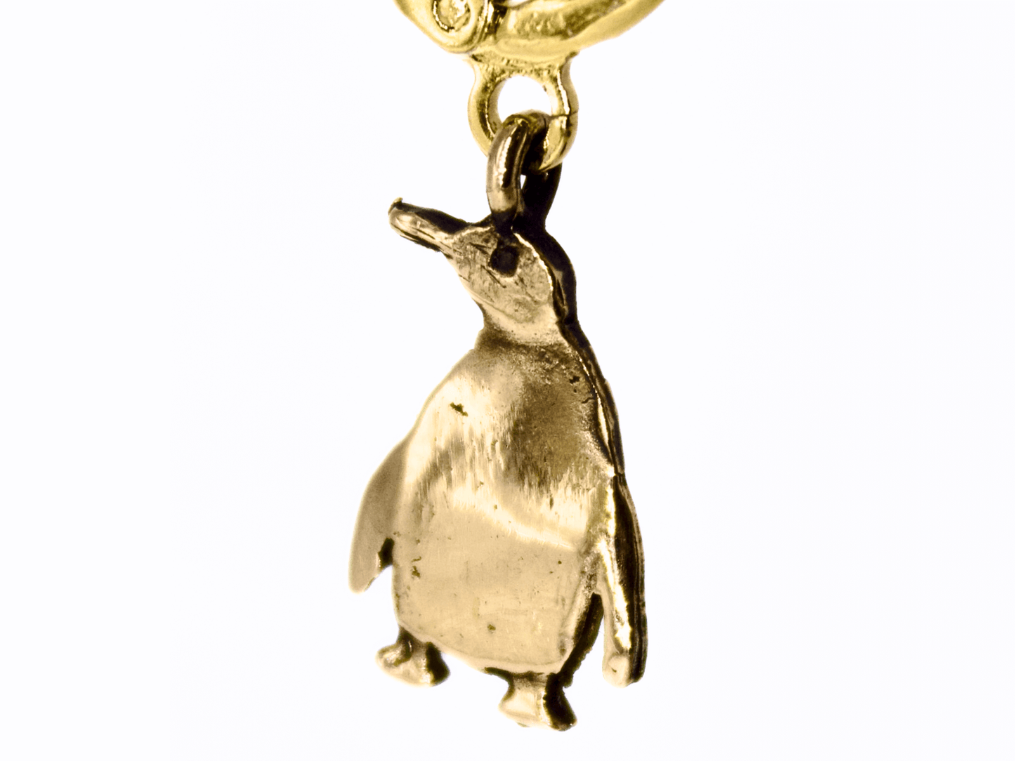 Bronze penguin earring pendant, handcrafted with intricate details, perfect for nature lovers.
