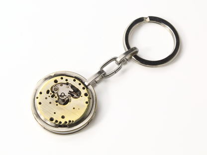 Portachiavi ingranaggi in metallo con design elegante e intricati dettagli meccanici