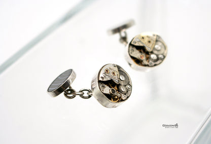 Gemelli a catena in argento con meccanismo di orologio d'epoca e onice striato