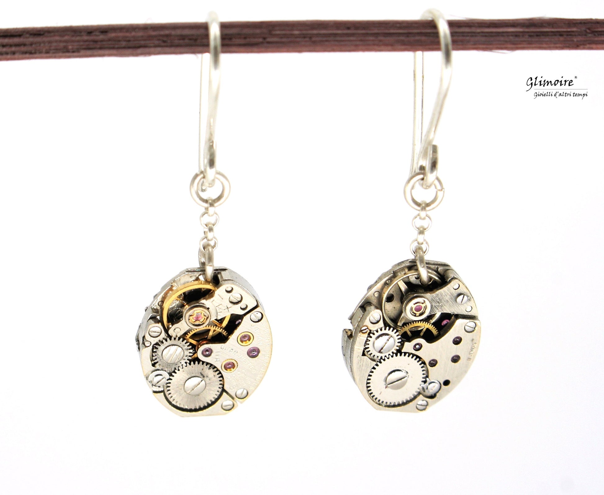 Coppia di orecchini pendenti in argento con meccanismi di orologi seiko con rubini a vista art.227 - Glimoire