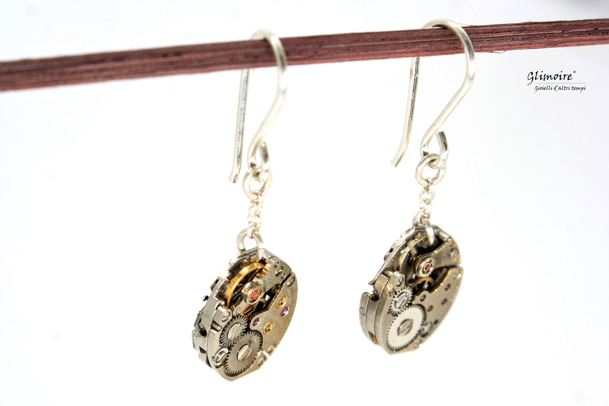 Coppia di orecchini pendenti in argento con meccanismi di orologi seiko con rubini a vista art.227 - Glimoire